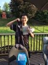 Justin showing off his farewell gifts