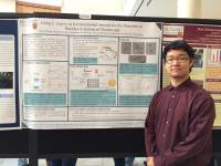 Simon Zhang by his poster